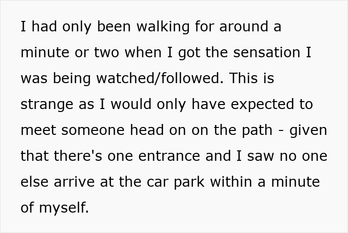 Person walking cautiously in the woods, sensing they are being followed by strange man nearby in a quiet forest path. Person walking cautiously in the woods, sensing they are being followed by strange man nearby in a quiet forest path.
