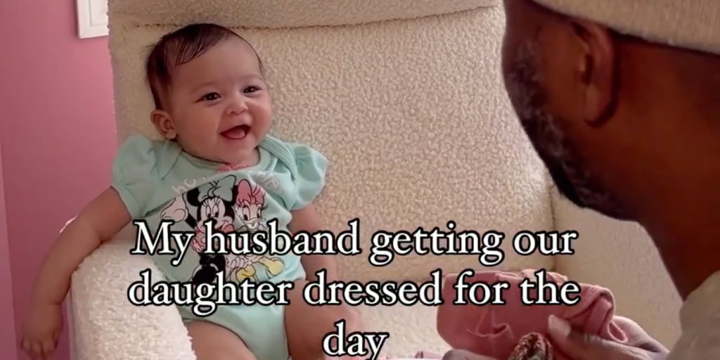 Dad chats with infant daughter about her outfit in adorable video